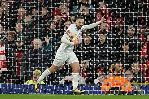 Barnsley's Adam Phillips celebrates after scoring during the FA Cup third round soccer match between Liverpool and Barnsley in Liverpool, England.