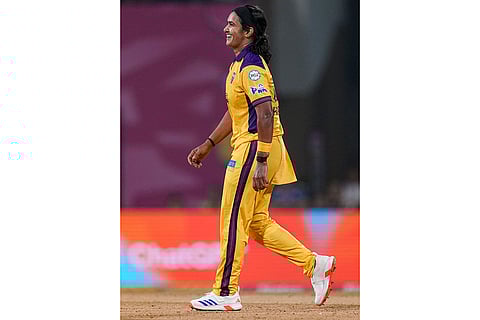 UP Warriorz's Shikha Pandey after taking the wicket of Royal Challengers Bengaluru's Grace Harris during a Women's Premier League (WPL) T20 cricket match between Royal Challengers Bengaluru and UP Warriorz, at the DY Patil Stadium in Navi Mumbai.