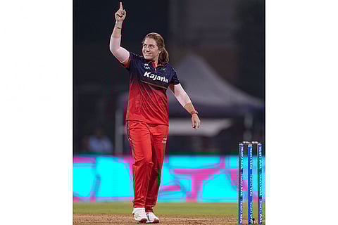 Royal Challengers Bengaluru's Nadine de Klerk celebrates after the wicket of UP Warriorz's Kiran Navgire during a Women's Premier League (WPL) T20 cricket match between Royal Challengers Bengaluru and UP Warriorz, at the DY Patil Stadium in Navi Mumbai.