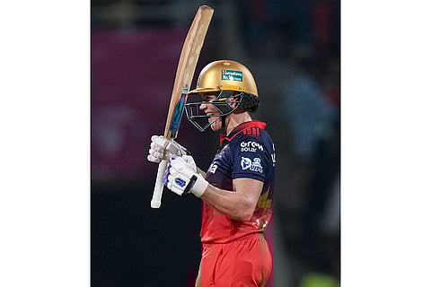 Royal Challengers Bengaluru's Grace Harris celebrates her half century during a Women's Premier League (WPL) T20 cricket match between Royal Challengers Bengaluru and UP Warriorz, at the DY Patil Stadium in Navi Mumbai.