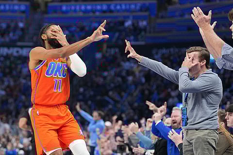Oklahoma City Thunder guard Isaiah Joe (11) celebrates with fans during the second half of an NBA basketball game against the Miami Heat in Oklahoma City.