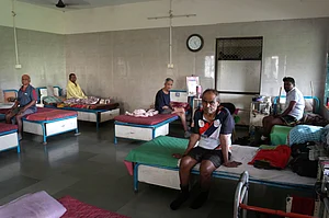 Photo by: Dinesh Parab/Outlook : In the clinic three to four beds next to one each other. With every person longing for lost families.