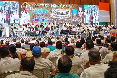 In this image received on Jan. 13, 2026, Karnataka Deputy Chief Minister DK Shivakumar with other leaders during the ‘MGNREGA Bachao Sangram’, a mass outreach campaign over the replacement of the Mahatma Gandhi National Rural Employment Guarantee Act (MGNREGA) with the Viksit Bharat-Guarantee for Rozgar and Ajeevika Mission Act, or VB-G RAM G, in Bengaluru. () ()