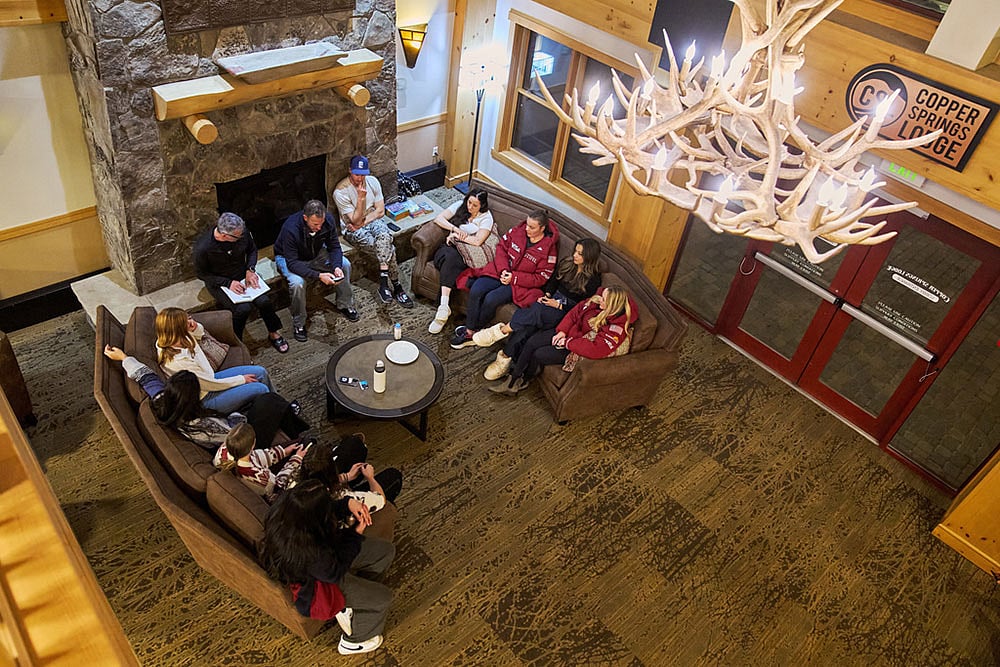 Members of the U.S. Womens Ski Team have a team meeting with coaches