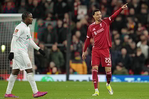 Liverpool's Hugo Ekitike reacts after scoring during the FA Cup third round soccer match between Liverpool and Barnsley in Liverpool, England.