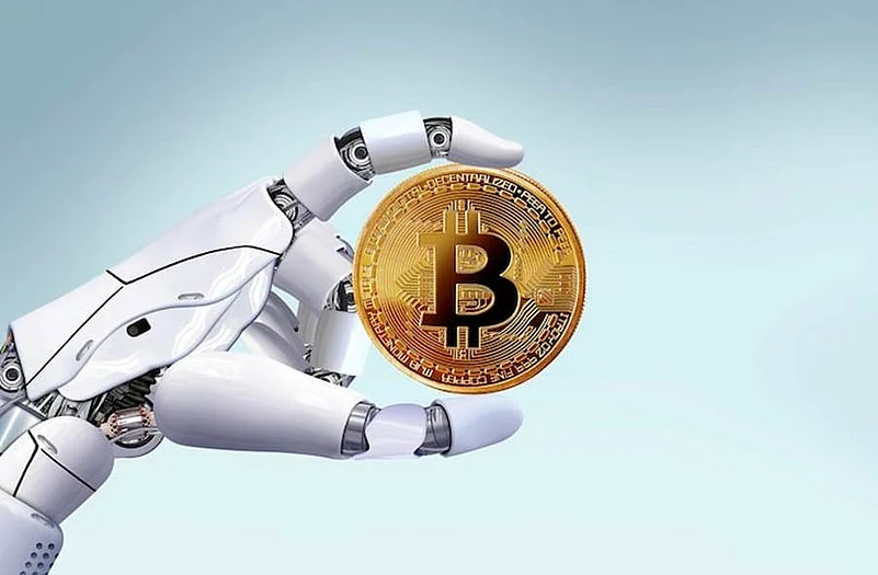 Robots hand holding a Bitcoin coin