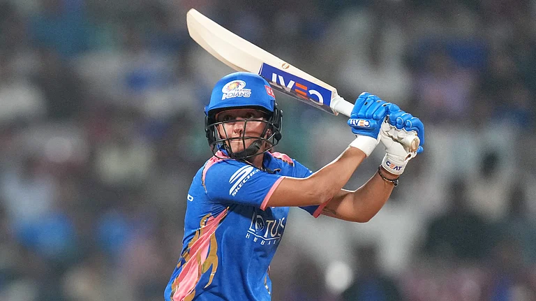 Mumbai Indians' captain Harmanpreet Kaur plays a shot during their Women's Premier League match against Gujarat Giants at the DY Patil Stadium in Navi Mumbai. - PTI