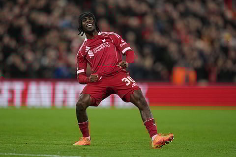 Liverpool's Jeremie Frimpong celebrates after scoring during the FA Cup third round soccer match between Liverpool and Barnsley in Liverpool, England.