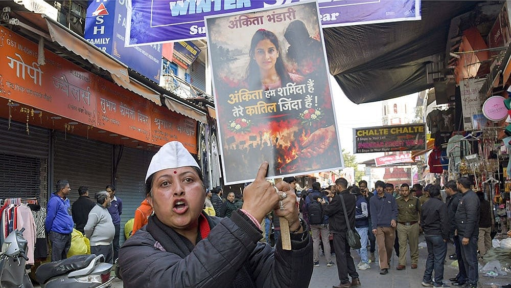 A protester holds a placard during a statewide bandh called by social groups and political organisations over the Ankita Bhandari murder case, in Dehradun | Representational - Photo: PTI