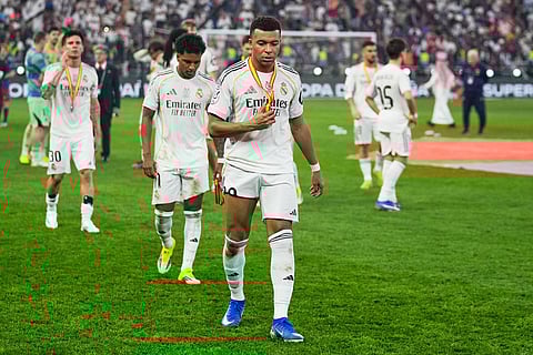 Real Madrid's Kylian Mbappe leaves the pitch after losing the Spanish Super Cup final soccer match against FC Barcelona at King Abdullah Sports City Stadium in Jeddah, Saudi Arabia.