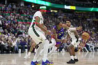 NBA: Denver Nuggets Pip Milwaukee Bucks 108-104 Despite Long Injury List | Photo: AP/David Zalubowski : Denver Nuggets guard Peyton Watson, center, loses control of the ball while driving between Milwaukee Bucks center Myles Turner, front, and guard Gary Harris in the second half of an NBA basketball game in Denver.