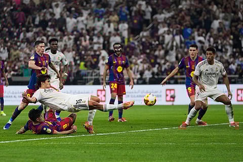 Real Madrid's Gonzalo Garcia scores against FC Barcelona during the Spanish Super Cup final soccer match at King Abdullah Sports City Stadium in Jeddah, Saudi Arabia.