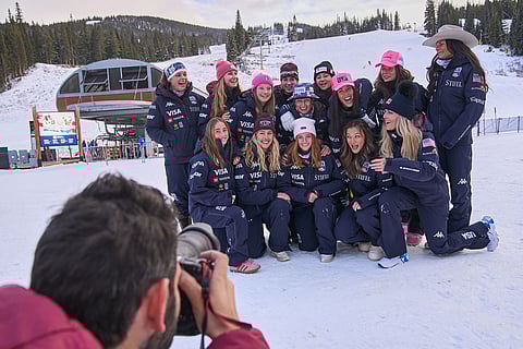 Members of the U.S. Women's Ski Team, including Lindsey Vonn, bottom right, and Breezy Johnson, top left, joke together while gathering for a team photo at Copper Mountain, Colo.
