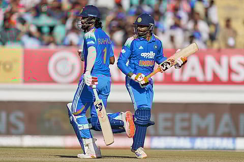 India's KL Rahul, left, and India's Ravindra Jadeja run between the wickets to score during the second One Day International cricket match between India and New Zealand in Rajkot, India.