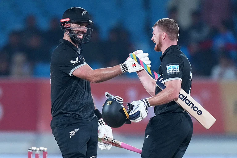 New Zealand's Daryl Mitchell, left, and New Zealand's Glenn Phillips celebrate their win during the second One Day International cricket match between India and New Zealand in Rajkot, India. - Photo: AP/Ajit Solanki