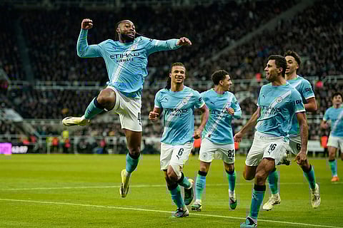 Manchester City's Antoine Semenyo, left, celebrates a goal that was later disallowed by a VAR decision during the English League Cup semifinal first leg soccer match between Newcastle and Manchester City in Newcastle, England.