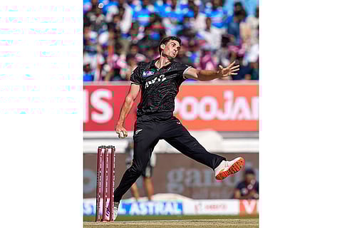 New Zealand's Kristian Clarke bowls during the second ODI cricket match of a series between India and New Zealand, at Niranjan Shah Stadium, in Rajkot, Gujarat.
