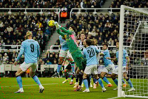 Manchester City's goalkeeper James Trafford clears the ball during the English League Cup semifinal first leg soccer match between Newcastle and Manchester City in Newcastle, England.