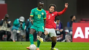 | Photo: AP/Themba Hadebe : Senegal's Sadio Mane is challenged by Egypt's Mohamed Hany during the Africa Cup of Nations semifinal match on Wednesday, January 14, 2026.