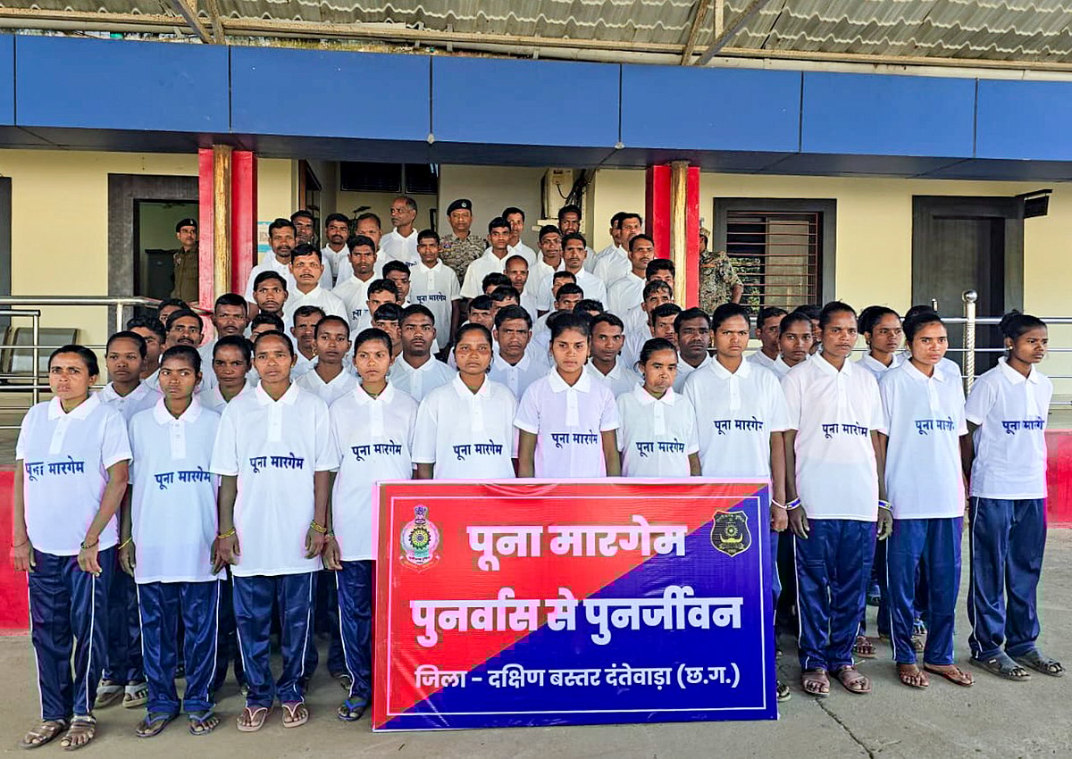 In this handout image released on Jan. 9, 2026, as many as 63 Naxalites, 36 of them carrying a collective bounty of over Rs 1.19 crore, pose for a group picture after their surrender, in Chhattisgarh's Dantewada district. The cadres, including 18 women, turned themselves in before senior police and Central Reserve Police Force (CRPF) officials, under the 'Poona Margem' initiative. - PTI