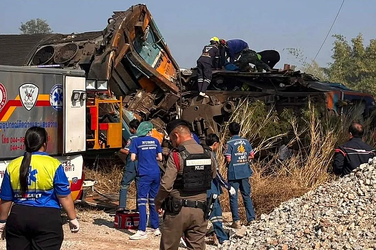 This photo released from State Railway of Thailand, shows aid workers after a construction crane fell into a passenger train in Nakhon Ratchasima province, Thailand Wednesday, Jan. 14, 2026. - AP