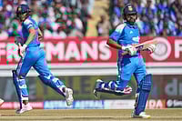 | Photo: AP/Ajit Solanki : India's Rohit Sharma, right, and India's captain Shubman Gill run between the wickets to score during the second One Day International cricket match between India and New Zealand in Rajkot, India.