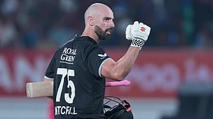 (AP Photo/Ajit Solanki) : New Zealand's Daryl Mitchell celebrates after scoring a century during the second One Day International cricket match between India and New Zealand in Rajkot, India, Wednesday, Jan. 14, 2026