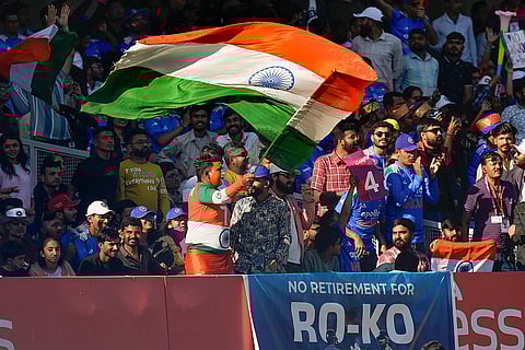 Indian fans cheer during the second ODI cricket match of a series between India and New Zealand, at Niranjan Shah Stadium, in Rajkot, Gujarat.