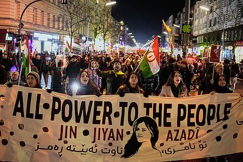 Protesters participate in a demonstration in support of the nationwide mass protests in Iran against the government, in Berlin, Germany.