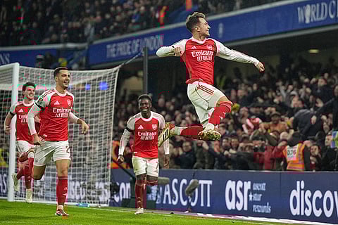 Arsenal's Martin Zubimendi celebrates after scoring his side's third goal during the English League Cup semifinal first leg soccer match between Chelsea and Arsenal in London.