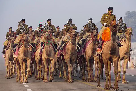 Members of the BSF Camel Contingent take part in rehearsals for the upcoming Republic Day Parade on a cold winter morning, in New Delhi.