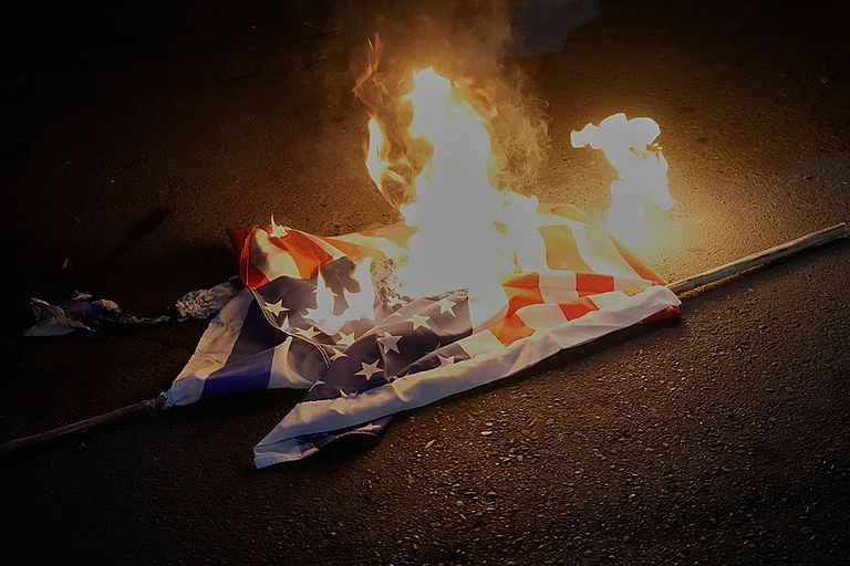 Representational image: American and Israeli flags are set on fire during a protest by hardline supporters of the Iranian government, in front of the British Embassy, in Tehran, Iran. - | Photo: AP/Vahid Salemi