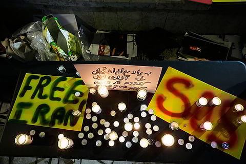 Demonstrators light candles during a rally in support of anti-government protests in Iran, in Holon, Israel.