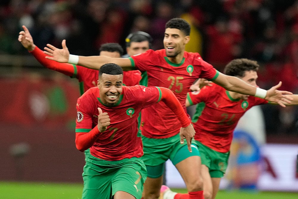 Morocco players celebrate after winning after a penalty shootout during the Africa Cup of Nations semi-final match between Nigeria and Morocco in Rabat, Morocco. - | Photo: AP/Mosa'ab Elshamy