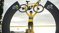 | Photo: AP/Daniel Cole : Tour de France winner Denmark's Jonas Vingegaard, wearing the overall leader's yellow jersey, celebrates on the podium after the last stage of the Tour de France cycling race in Paris, France, Sunday, July 23, 2023. 