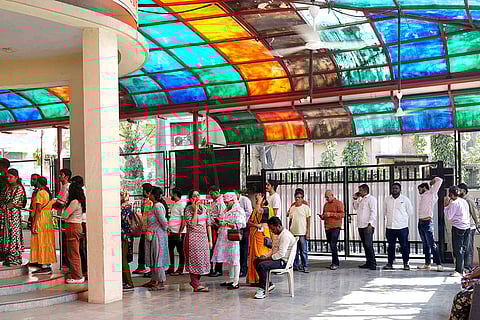Voters line up in queue for civic elections