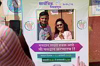 | Photo: Dinesh Parab/Outlook : Voters pose infront of a selfie counter near the polling station