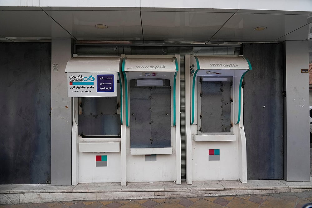 A banks ATMs and windows are covered with metal sheets in Iran