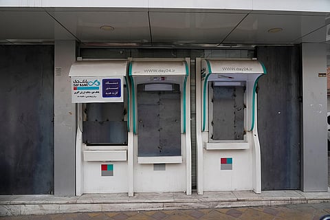 A bank's ATMs and windows are covered with metal sheets after anti-government protests in Tehran, Iran.