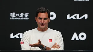 (AP Photo/Mark Baker) : Roger Federer of Switzerland gestures during a press conference ahead of the Australian Open tennis championship in Melbourne, Australia, Thursday, Jan. 15, 2026
