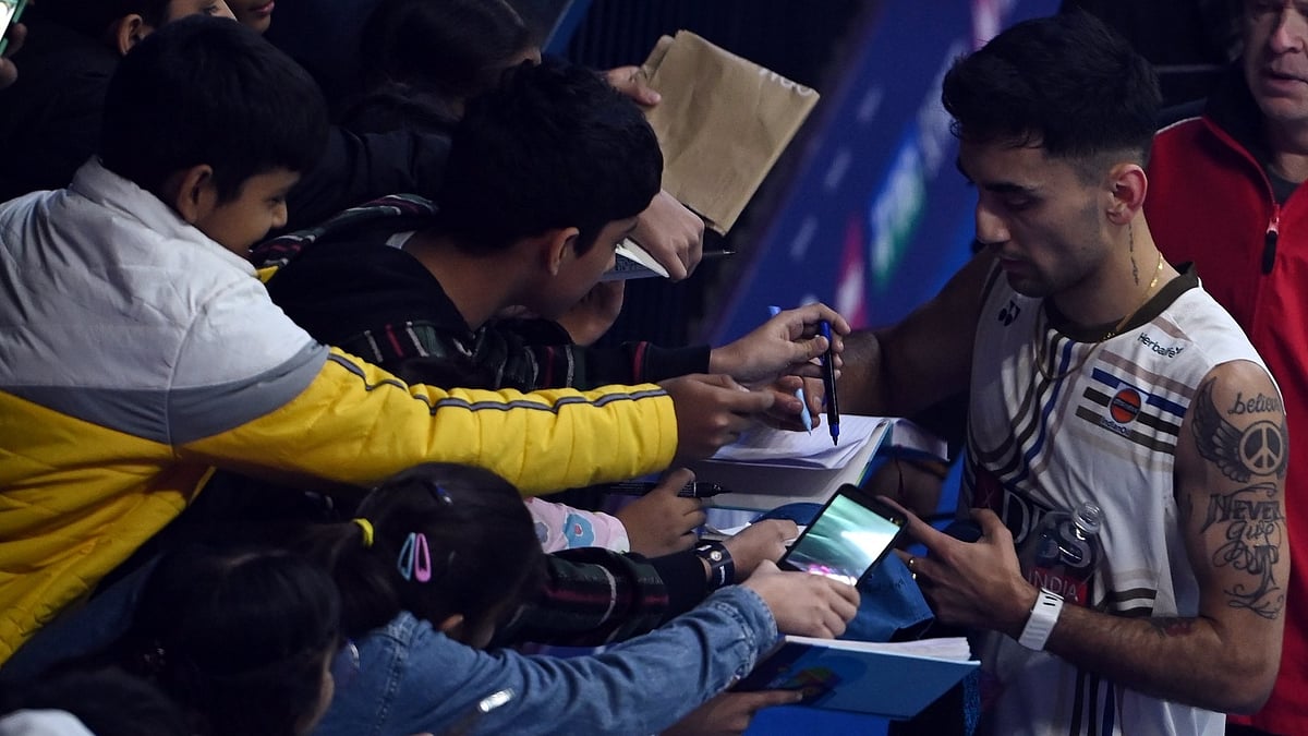 Lakshya Sen signs autographs after his India Open match against Kenta Nishimoto on January 15, 2026. - | Photo: BAI_media