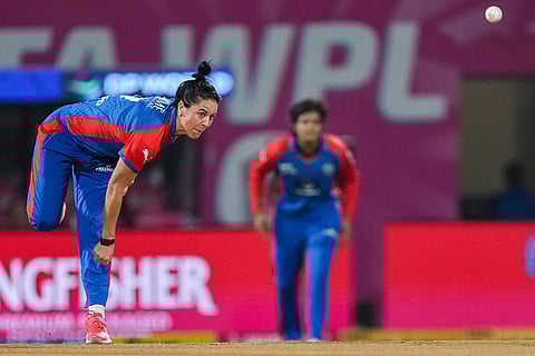 Delhi Capitals' Marizanne Kapp bowls during a Women's Premier League (WPL) T20 cricket match between Delhi Capitals and UP Warriorz, at the DY Patil Stadium in Navi Mumbai.
