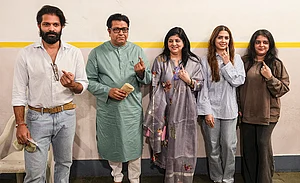 | Photo: PTI/Kunal Patil : Maharashtra Navnirman Sena (MNS) chief Raj Thackeray with party leader and his son Amit Thackeray and other family members, shows his ink-marked finger after casting a vote in the Brihanmumbai Municipal Corporation (BMC) polls, in Mumbai.
