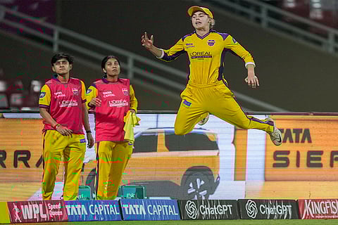 UP Warriorz' Phoebe Litchfield attempts to stop a six during the Women's Premier League (WPL) 2026 T20 cricket match between UP Warriorz and Delhi Capitals, at the DY Patil Stadium, in Navi Mumbai.