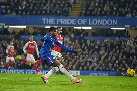 Chelsea's Josh Acheampong takes a shot on goal during the English League Cup semifinal first leg soccer match between Chelsea and Arsenal in London.