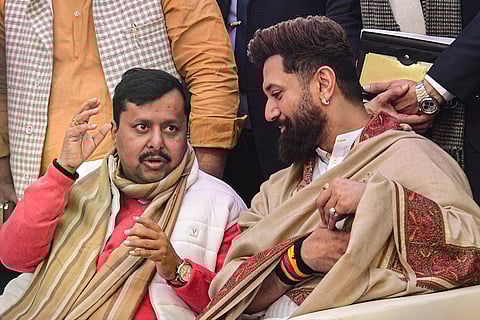 BJP National Working President Nitin Nabin, left, and Union Minister and Lok Janshakti Party (Ram Vilas) chief Chirag Paswan during the traditional 'Dahi Chura Bhoj' feast organised on Makar Sankranti at the BJP office, in Patna.