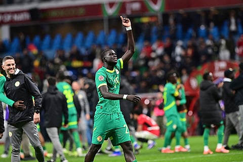 Senegal's El Hadji Malick Diouf celebrates victory after the Africa Cup of Nations semifinal soccer match between Senegal and Egypt, in Tangier, Morocco.