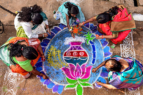 Women make ‘rangoli’ during the ‘Pongal’ festival celebrations, in Chikkamagaluru.