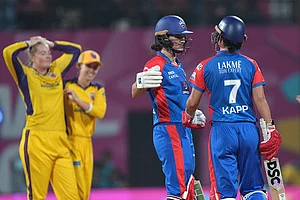| Photo: PTI/Kunal Patil : Delhi Capitals' Laura Wolvaardt and Marizanne Kapp wait for third umpire's decision regarding the latter's wicket after a review by UP Warriorz during the Women's Premier League (WPL) 2026 T20 cricket match between UP Warriorz and Delhi Capitals, at the DY Patil Stadium, in Navi Mumbai.