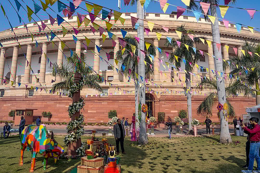 A person poses during an exhibition organised as part of the 28th Conference of Speakers and Presiding Officers of the Commonwealth (CSPOC), at Parliament House complex, in New Delhi. - | Photo: PTI/Shahbaz Khan